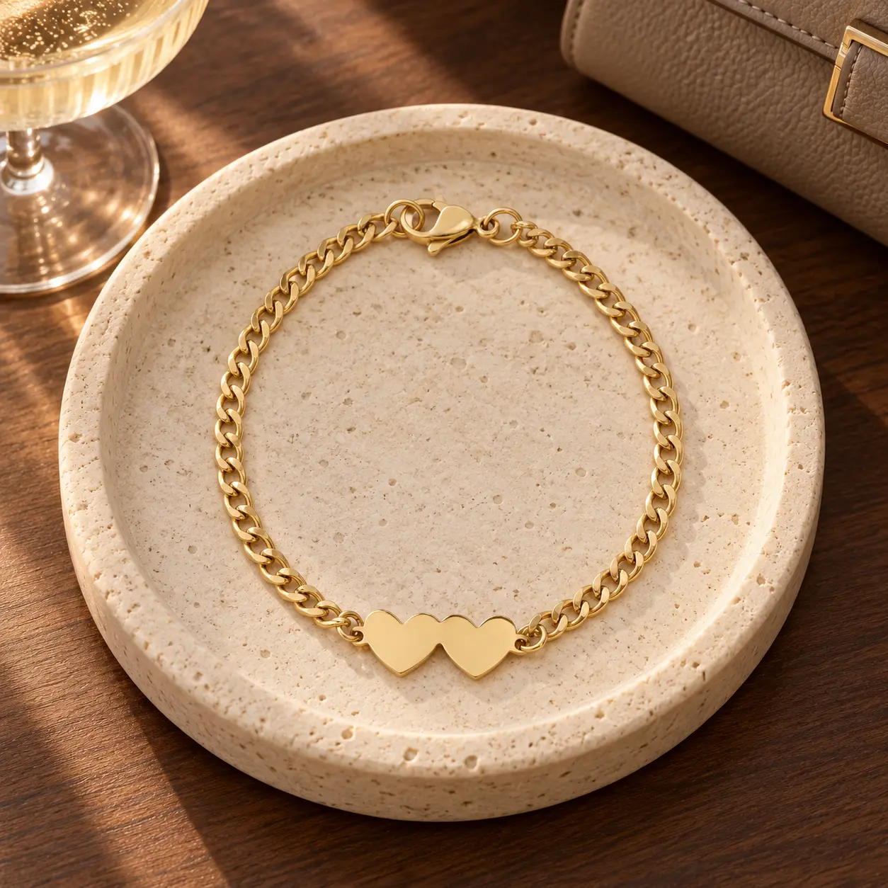 Gold Double Heart Chain Bracelet with two connected heart centerpieces and a curb-style chain